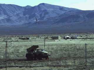 GUNS!!!!. /missiles.. I guess no one else noticed the one gif is reversed, giving the guy in the helicopter a magic puti-together gun.