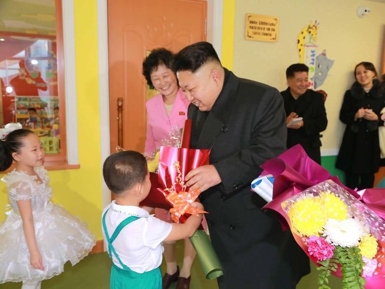 Glorious Admin Comp. Admin making fun of OP with all of his buff handsome friends. Admin delivers a New Year address in Pyongyang on Jan. 1 in this photo releas