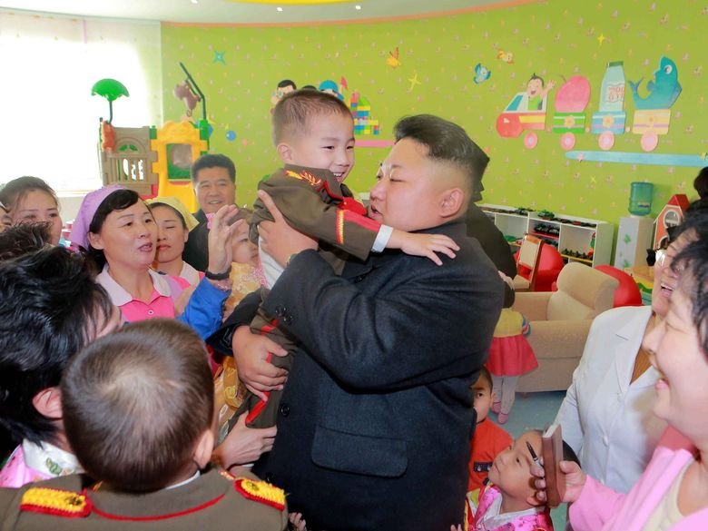 Glorious Admin Comp. Admin making fun of OP with all of his buff handsome friends. Admin delivers a New Year address in Pyongyang on Jan. 1 in this photo releas