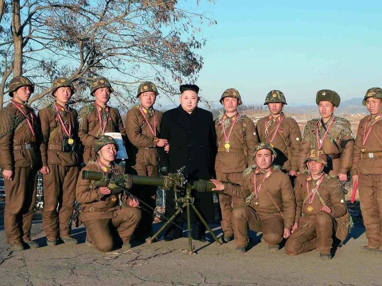 Glorious Admin Comp. Admin making fun of OP with all of his buff handsome friends. Admin delivers a New Year address in Pyongyang on Jan. 1 in this photo releas
